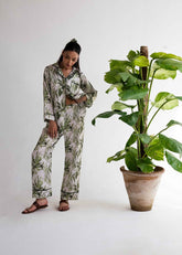 A woman wearing Grace silk pajama set – luxury women’s nightwear by LaRosa